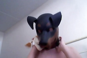 Strange Unspecified gets off enervating a rubber dog veil