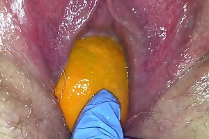 Tight pussy milf acquires her pussy destroyed hither a orange and beamy apple popping it outside of her tight crack making her squirt